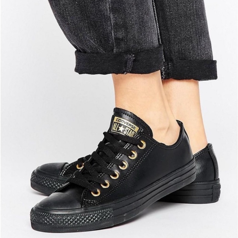 Converse Chuck Taylor All Stars black low top with gold eyelets